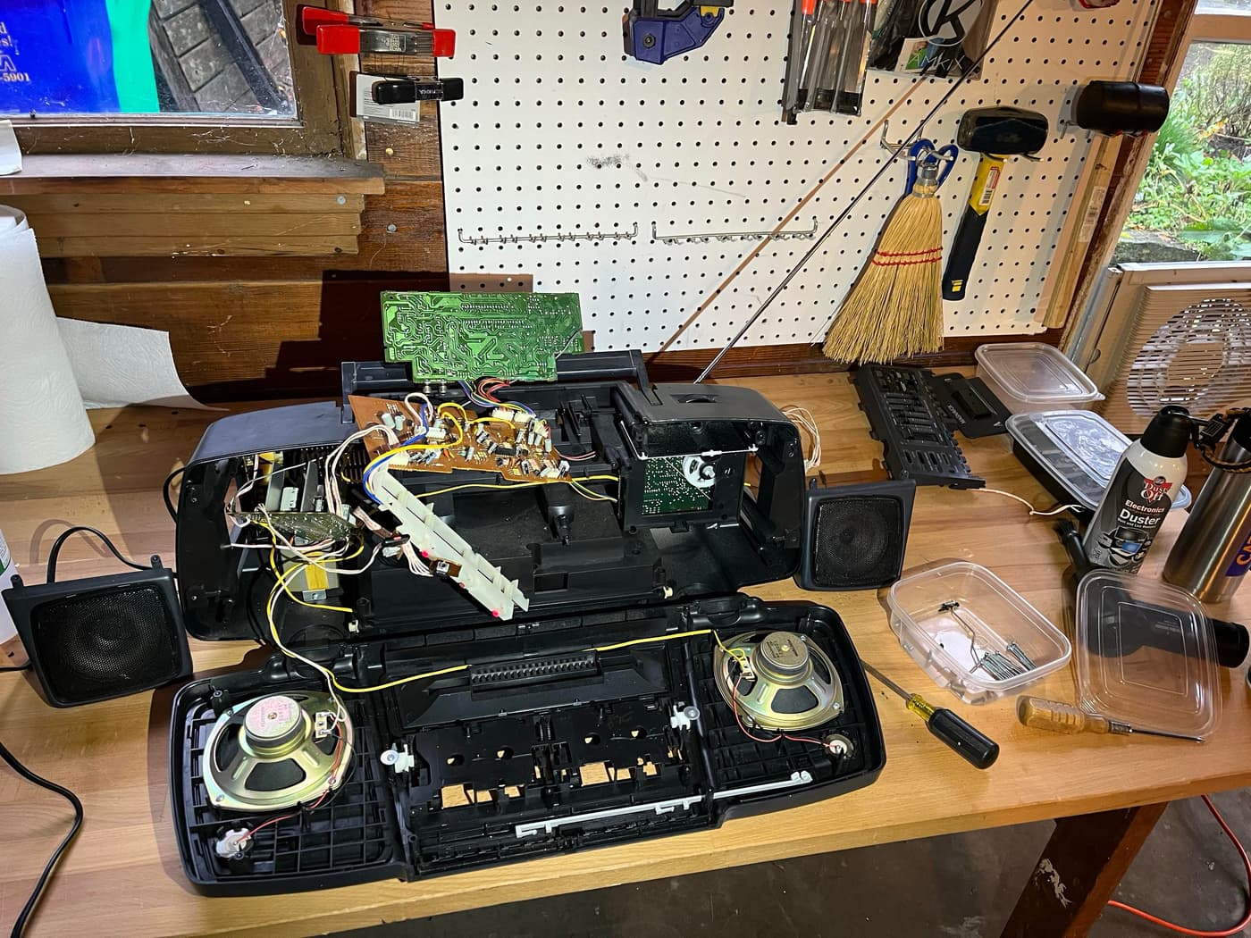 Disassembled boom box showing circuit boards and internal components