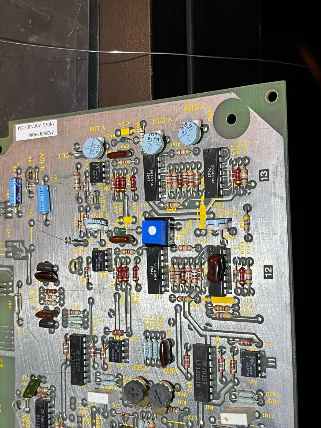 A close-up of a printed circuit board with various electronic components