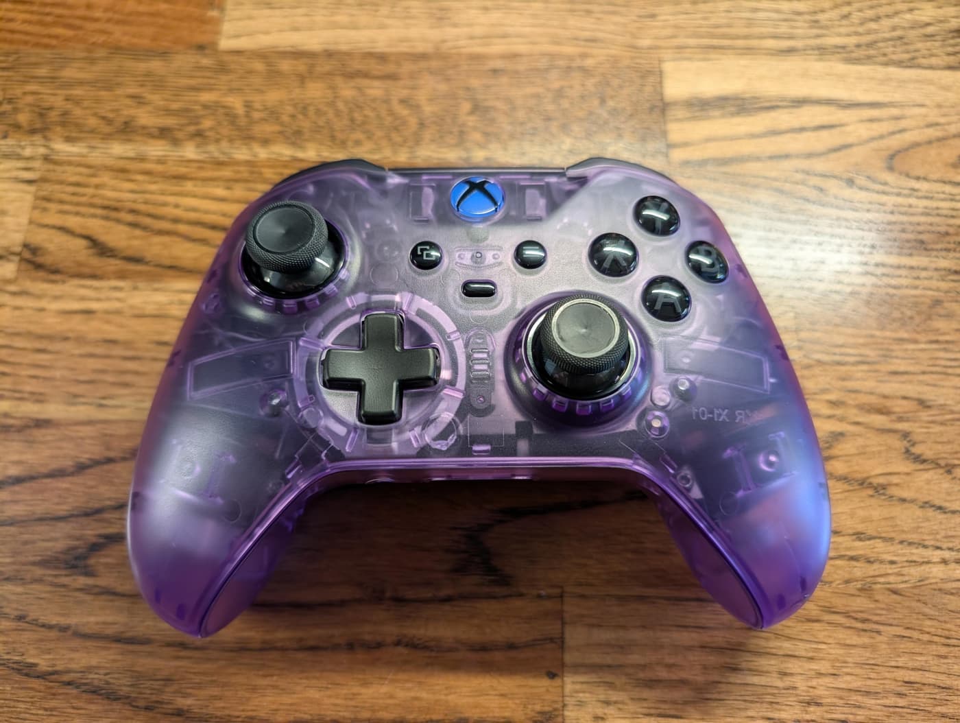 Photo of the top of an Xbox Elite 2 game controller, now in a shell of translucent purple plastic showing the innards