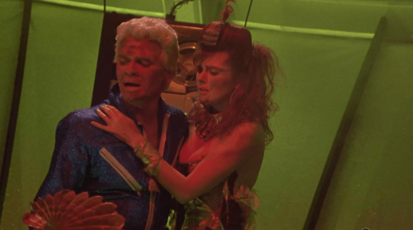 A screenshot from Starkiller, the movie-within-the-movie in Explorers. Robert Picardo is a blonde b-movie hero