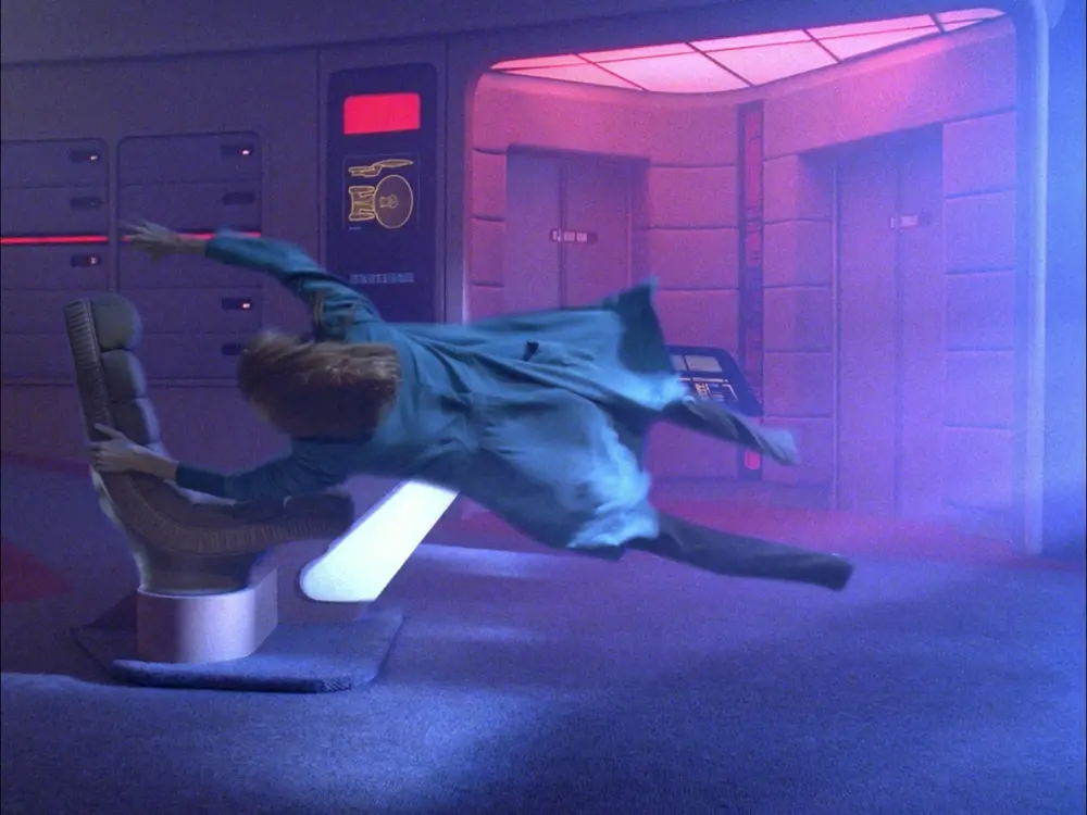 Dr. Crusher pulled off her feet and sucked sideways into a vortex on the Enterprise bridge